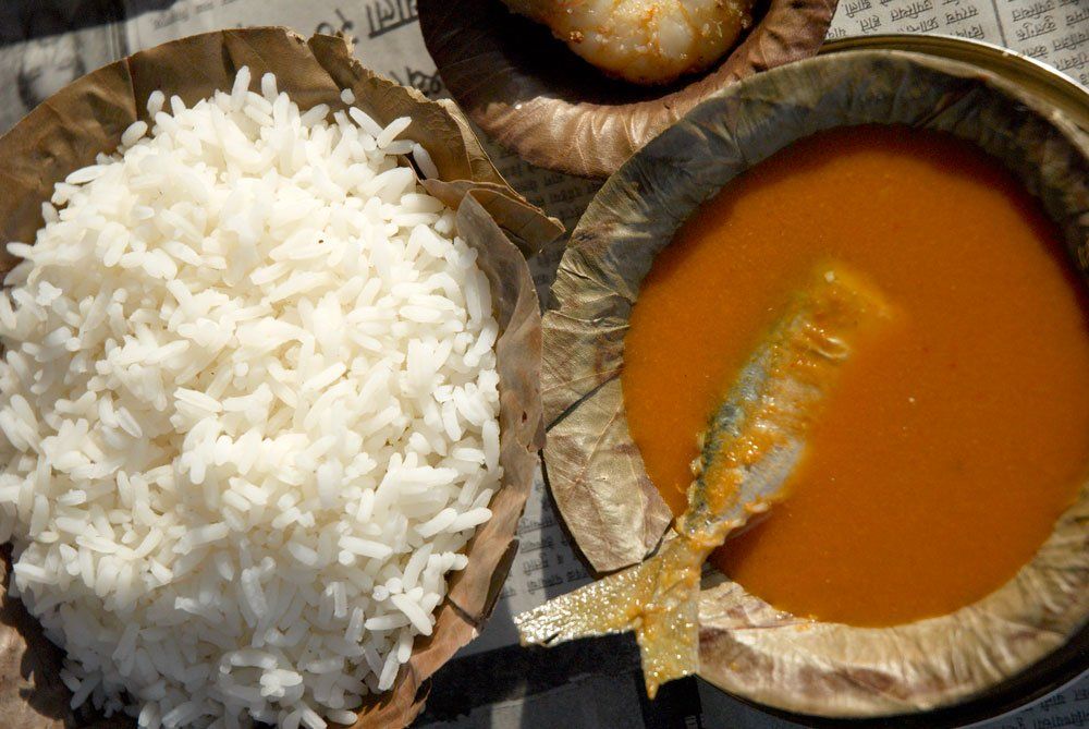 India, Goa, fish curry served with boiled white rice