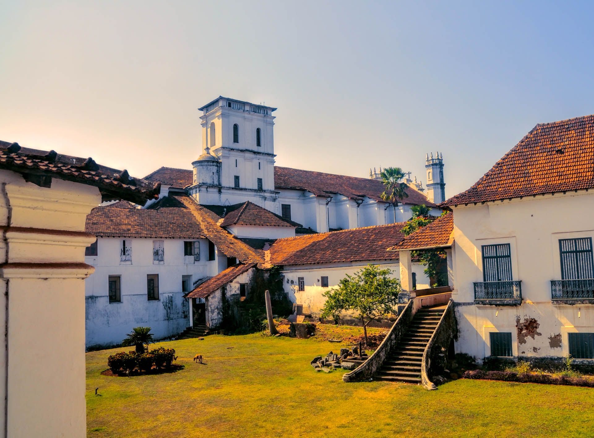 Scenic yard and old houses in historical town of Old Goa in India © Shutterstock