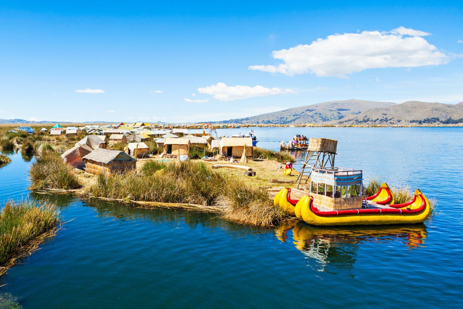 Island and canoes on Lake Titicaca, Peru © saiko3p/Shutterstock
